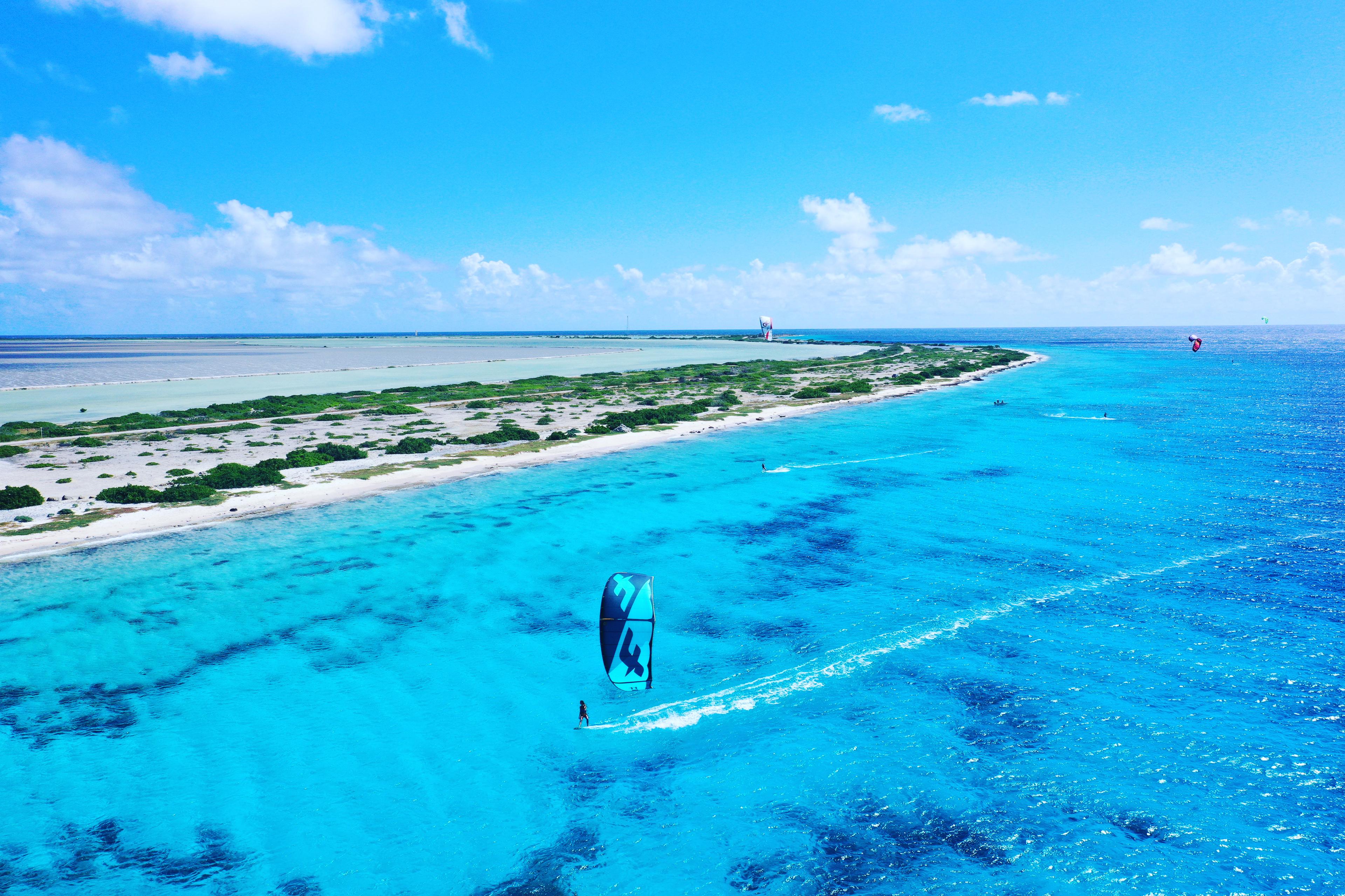 Go kitesurfing on the flattest water with good wind and noone on the water.